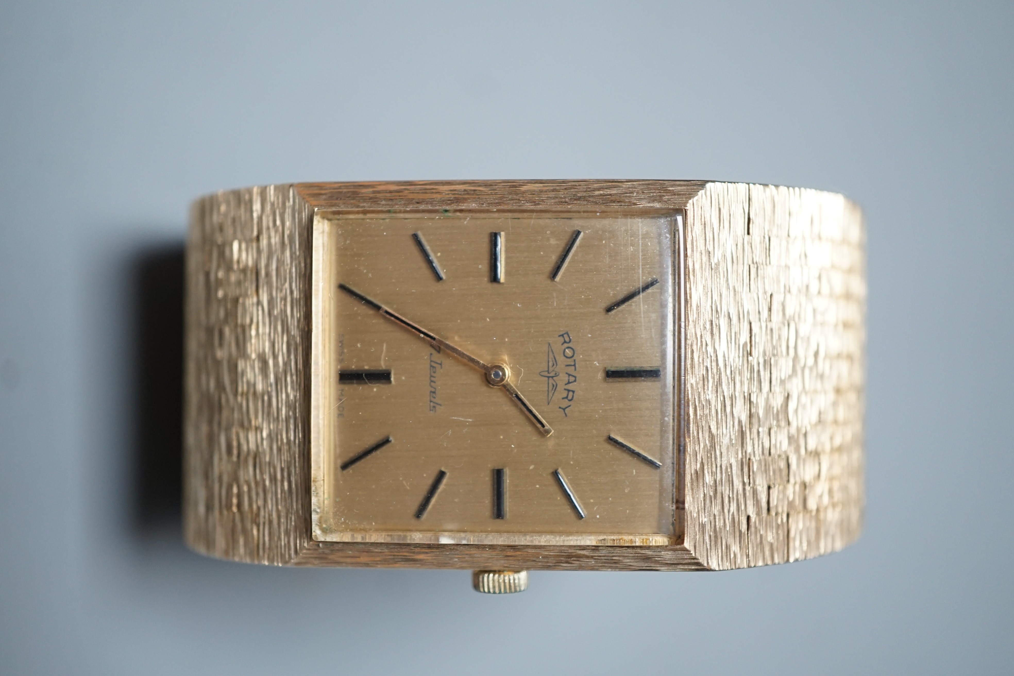 A gentleman's early 1970's textured 9ct gold Rotary manual wind dress wrist watch, with baton numerals, gross weight 67 grams, with Rotary box.